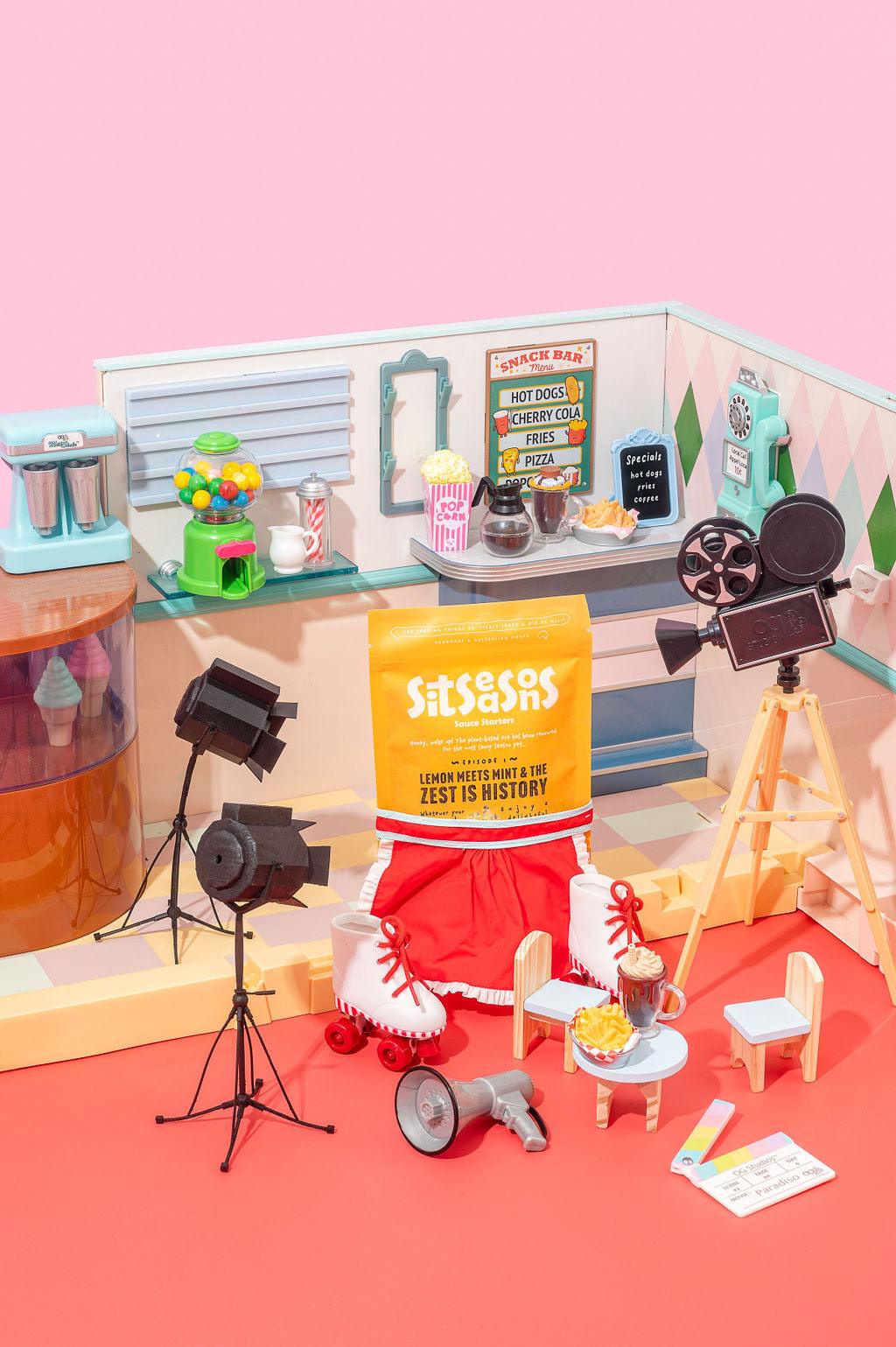 Yellow lemon seasoning packets wearing roller skates on a 50's diner movie set