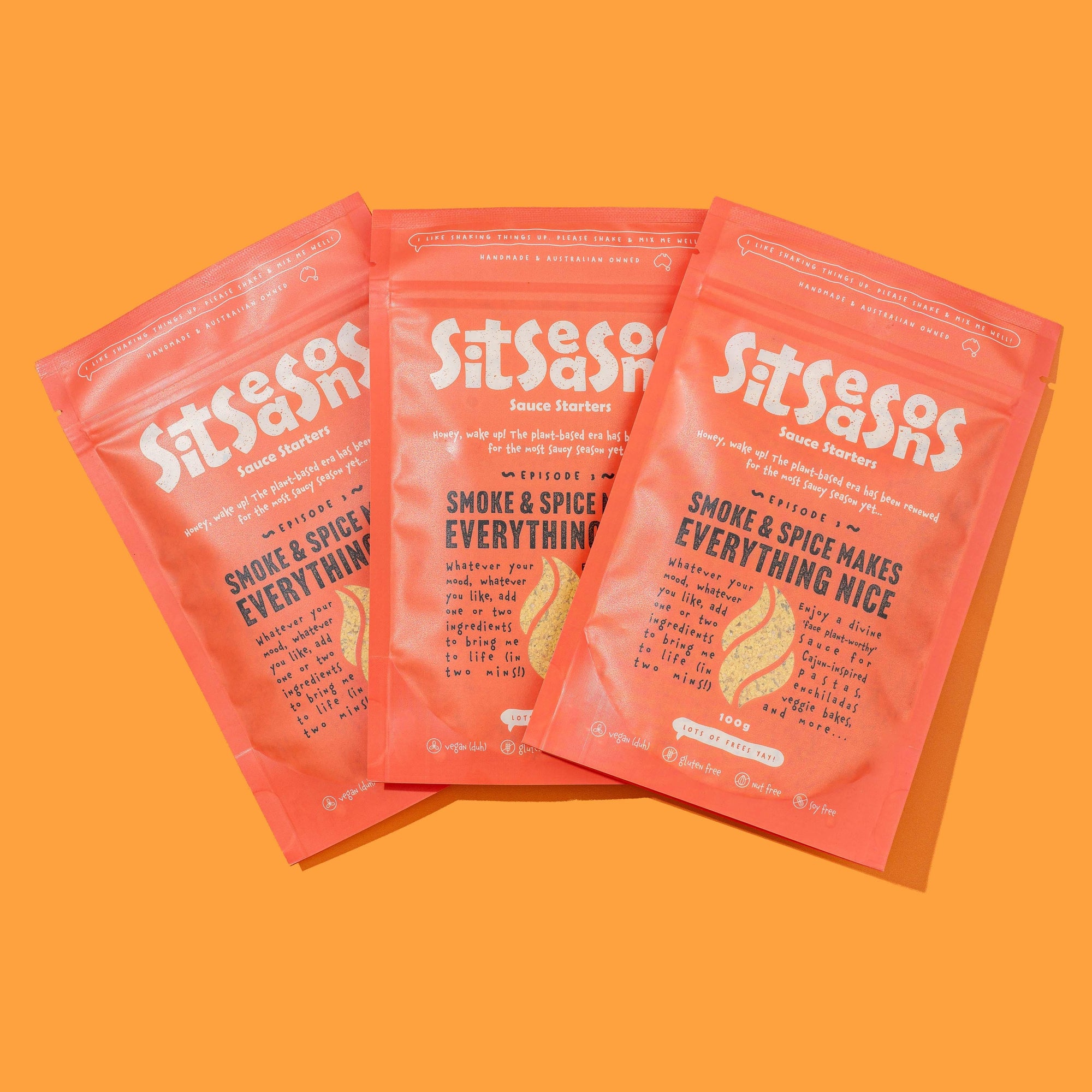 Three 100g red packets of vegan smoky spicy sauce