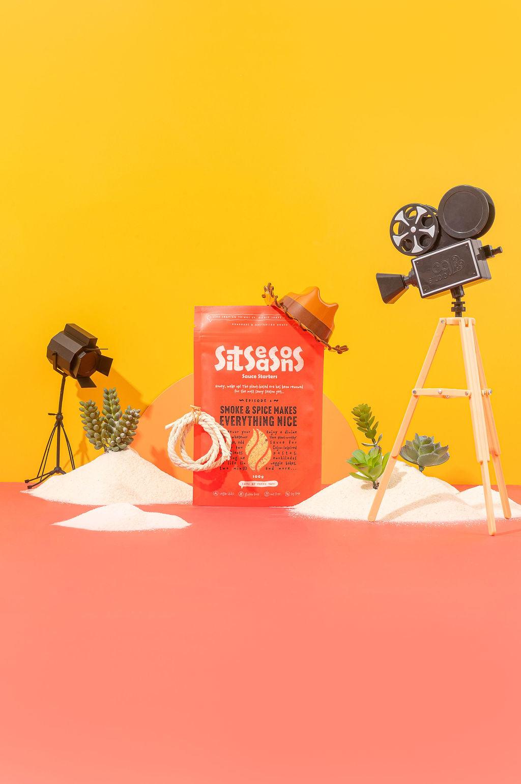 Red smoky spicy seasoning packet wearing a cowboy hat on a Western movie set